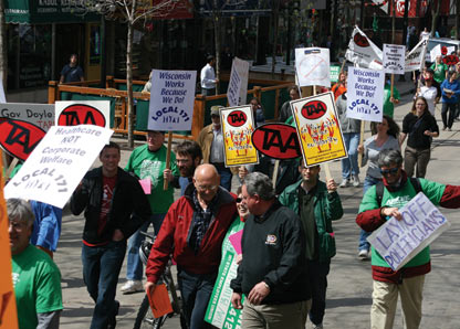 Ralliers decry state job cuts